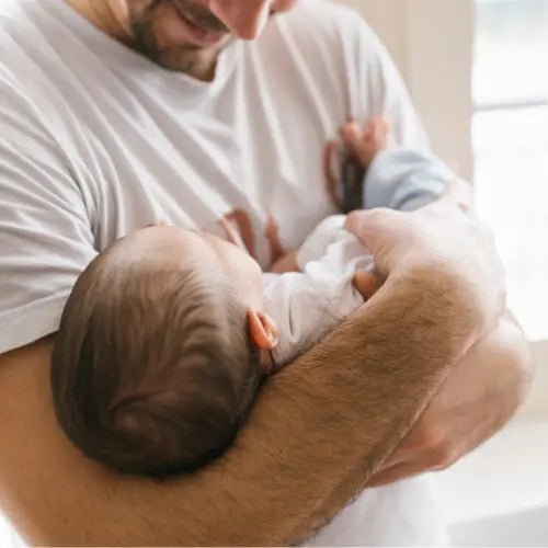 how to hold a newborn baby