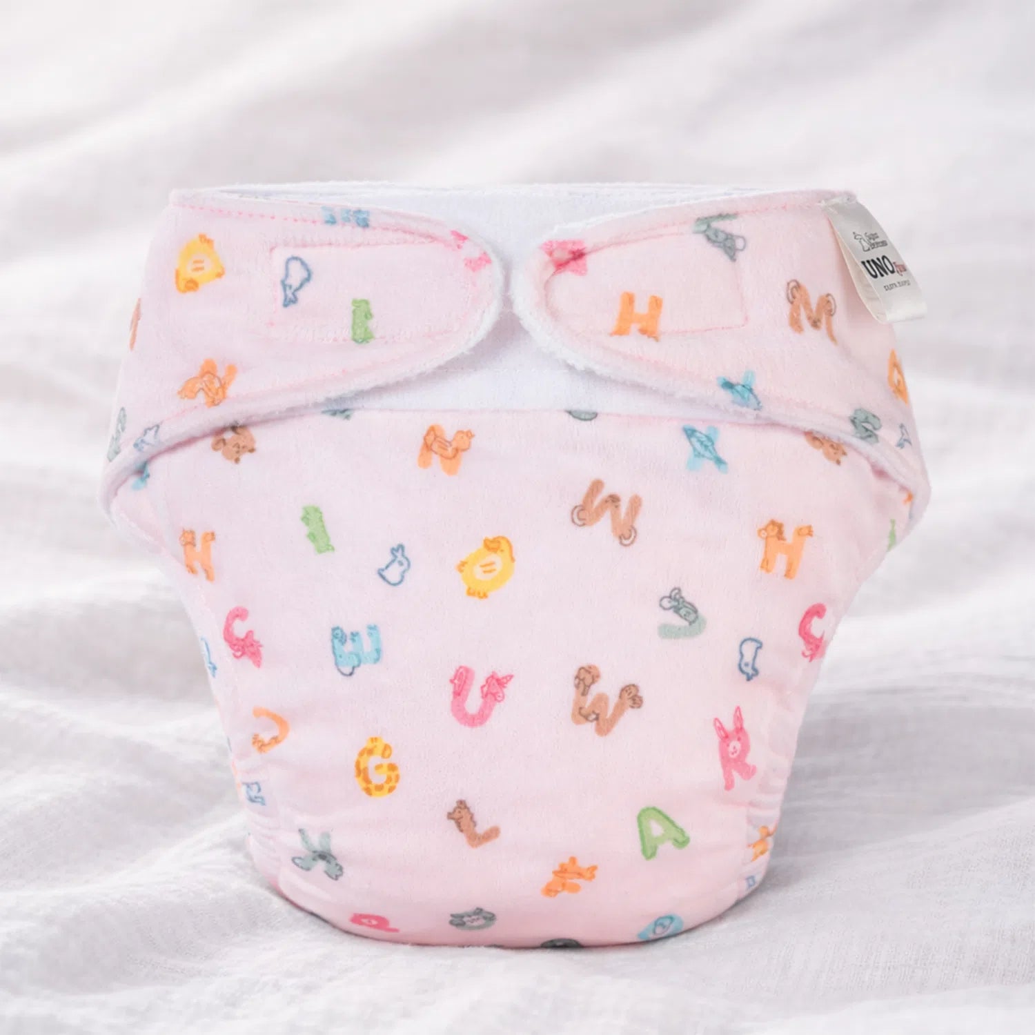 SuperBottoms UNO Luxe Diaper ABC Giggles print